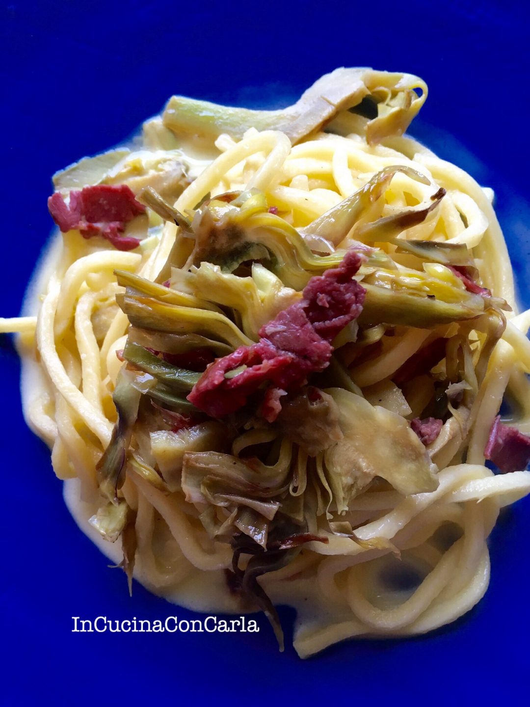 Troccoli con carciofi petto d'anatra affumicato e crema di fontina